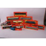 A large collection of Hornby OO gauge model railway carriages, track and accessories, mostly boxed