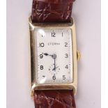 A yellow metal stamped 14ct Eterna wristwatch with white enamel dial, Arabic numerals and subsidiary