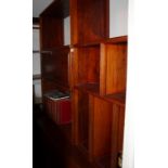 A Chinese hardwood wall unit, fitted open shelves and drop front compartment over three doors, 68"