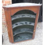 A late Georgian oak corner alcove with curved shelves, 27" wide x 11" deep x 34 1/2" high