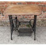 A cast iron sewing machine base, now converted as an occasional table