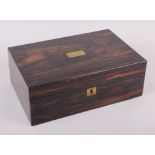 A 19th century coromandel writing box with brass escutcheon and fitted interior, 13 3/4" wide