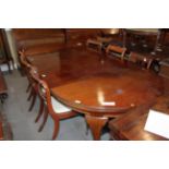 A 19th century mahogany extending dining table with three extra leaves, on cabriole supports and pad