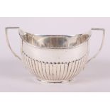 A silver two-handled sugar basin with half fluted decoration, 5.3oz troy approx