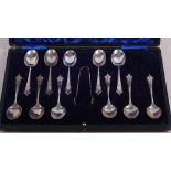Eleven silver teaspoons and matching sugar tongs, in fitted case, 4oz troy approx