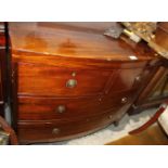 A 19th century mahogany bowfront chest of two short and two long drawers with brass ring handles,