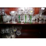 Two cut glass jugs, three cut glass decanters, eight cocktails and other table glass