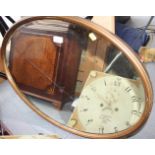 An oval wall mirror with bevelled plate, in gilt strip frame, plate 29" x 20"