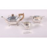 An octagonal silver three-piece teaset with a pair of silver sugar tongs, 32.2oz troy approx