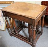 A nest of three oak occasional tables, on turned and stretchered supports, 21" wide x 14" deep x 20"