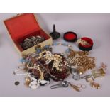 A quantity of costume jewellery, including beaded necklaces and brooches, a 9ct gold wedding band,