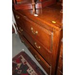 An oak chest of two short and two long drawers, on stile supports, 39" wide x 17" deep x 32 1/2"