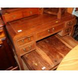 A Chinese hardwood desk, fitted one long and four small drawers, on shaped supports, 26" wide x