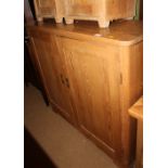 A pine side cupboard enclosed two doors, 48" wide x 40 1/2" deep x 44" high