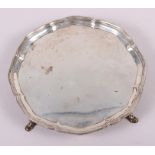 A silver pie crust salver, raised on four hoof feet, 8" dia, 13oz troy approx