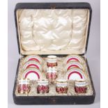 A cased set of six Cauldron bone china coffee cans with silver gilt mounts and six matching saucers