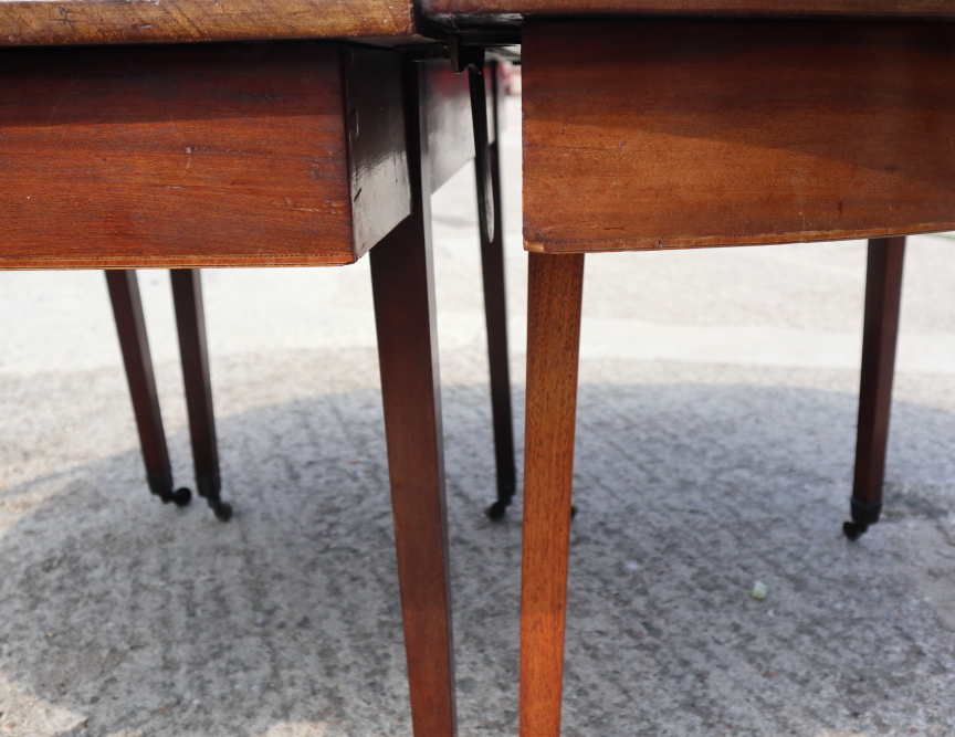 A late Georgian mahogany dining table with centre section, on square taper supports and brass - Image 2 of 3