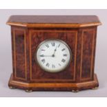 A walnut and inlaid cased mantel clock with white enamel dial