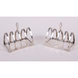 A pair of silver toast racks, 2.5oz troy approx