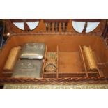 An early 20th century wickerwork picnic basket with part fitted interior, tin plates, cutlery,