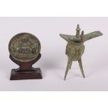 A bronze ritual ku, 7" high, and a medallion, on stand