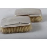 A pair of silver mounted hairbrushes