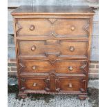 An oak chest of 17th century design with four long drawers, on shaped supports, 33" wide x 19"