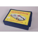 A Matchbox Series collectors case with a collection of Matchbox die-cast vehicles, including a