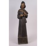 An antique carved wood and painted wood figure of a priest, on square base, 22" high