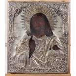 An Orthodox icon of Christ, in plated metal frame, 12 1/2" x 10 1/2"