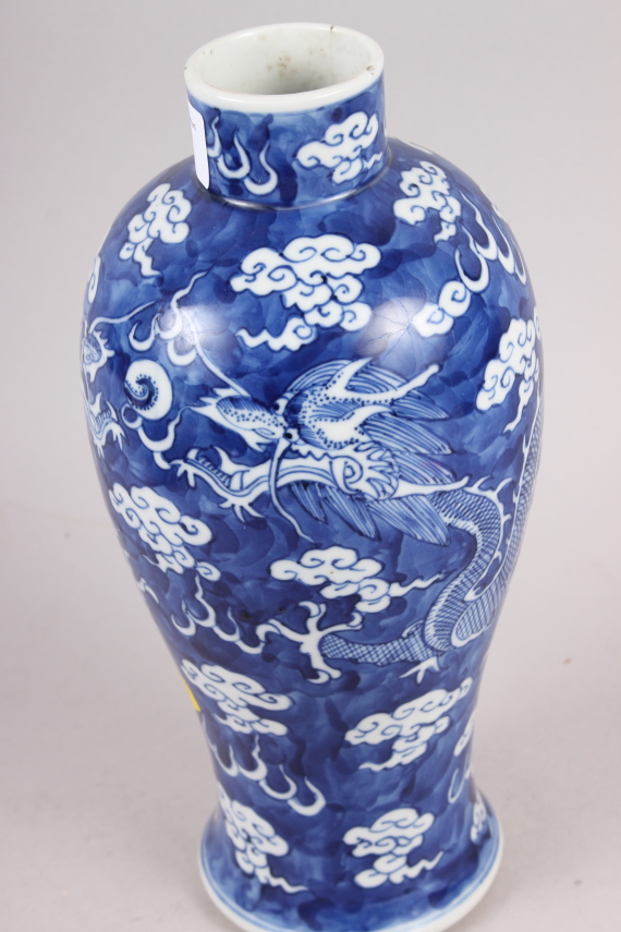 A 19th century Chinese blue and white oviform vase, decorated dragons on a cloud ground with four - Image 2 of 5