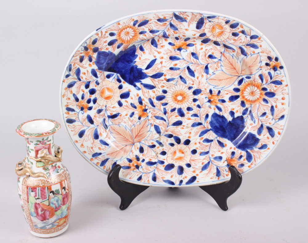 A 19th century Imari porcelain oval dish, 12" long, and a Cantonese famille verte decorated vase, 6"
