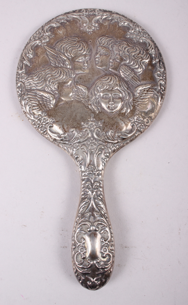 A pair of squat silver candlesticks embossed cherubs' heads, and a similar hand mirror, pin jar - Image 2 of 4