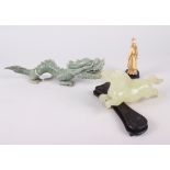 An Oriental jadeite carving of a dragon, 10" long, another jade carving of a horse (leg broken),