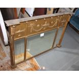 A triple beveled plate rectangular gilt framed over mantle mirror with swag and urn decoration