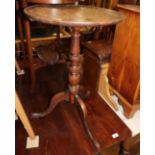 A mahogany circular top occasional table, on turned column and tripod splay support, 18" dia