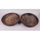 A pair of turned wood African bowls, sides carved crouching figures, 13 1/2" across