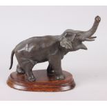 A Spelter model of an elephant, on oak stand, 8" high