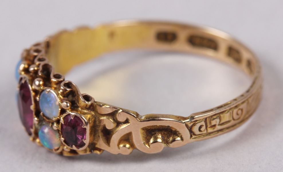 A late 19th century 15ct gold, ruby and opal dress ring with engraved shank, 1.9g, size P - Image 2 of 5