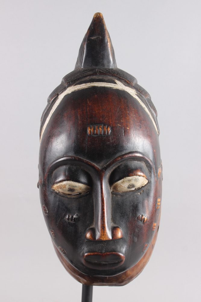 A West African carved hardwood tribal mask, on ebonised stand, 13 1/4" high - Image 6 of 6