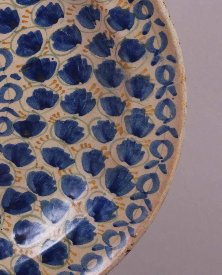 An 18th century Delft plate with all-over leaf and tendril design, 12" dia (rim chips) - Image 4 of 7
