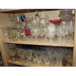 A quantity of glassware, including six champagne flutes, brandy balloons, tumblers, jugs, a cake