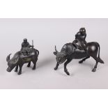 Two Chinese bronze models of figures on the back of buffalos, larger 6 1/4" high