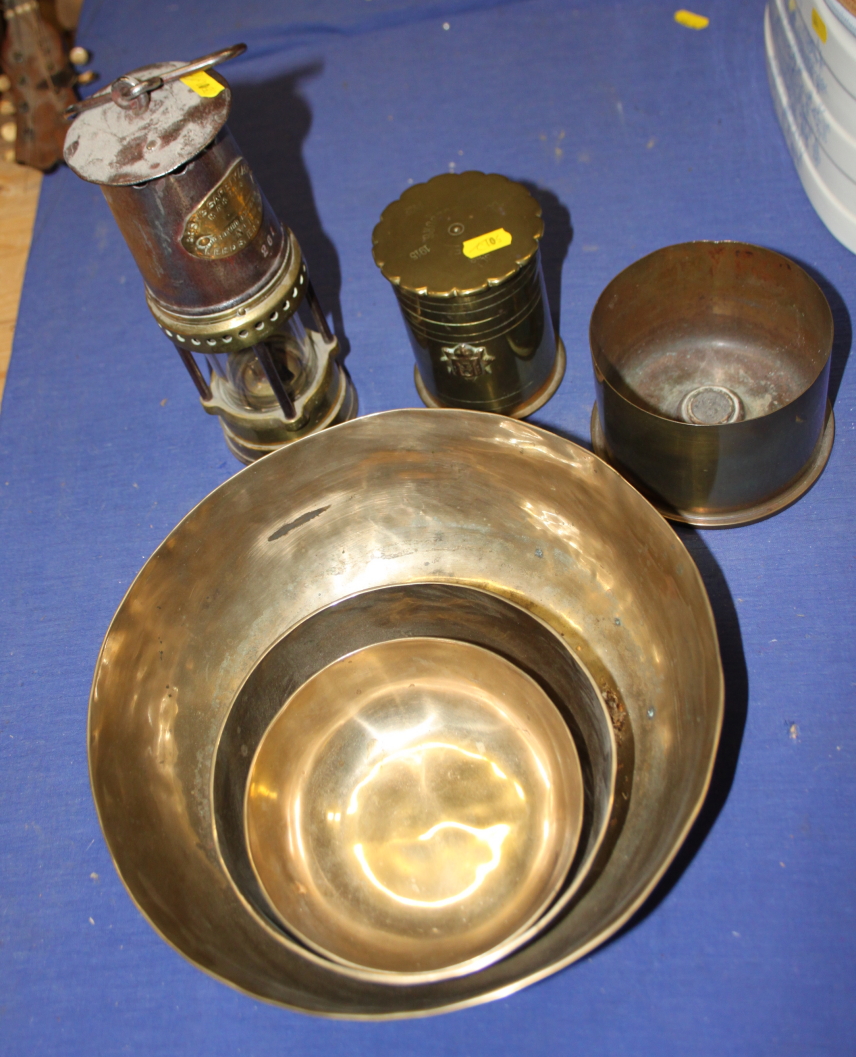 Two pieces of trench art, three bowls and a "Bests Safety Lamp" miner's lamp