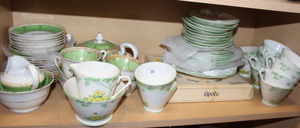 A New Chelsea green floral part teaset and a Mortlock's green and gilt decorated part teaset