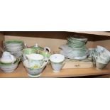 A New Chelsea green floral part teaset and a Mortlock's green and gilt decorated part teaset