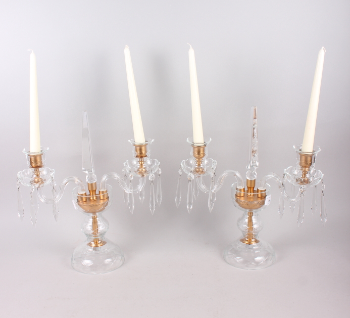 A pair of two-branch glass candlesticks, hung drops with central spire finial, 15" high