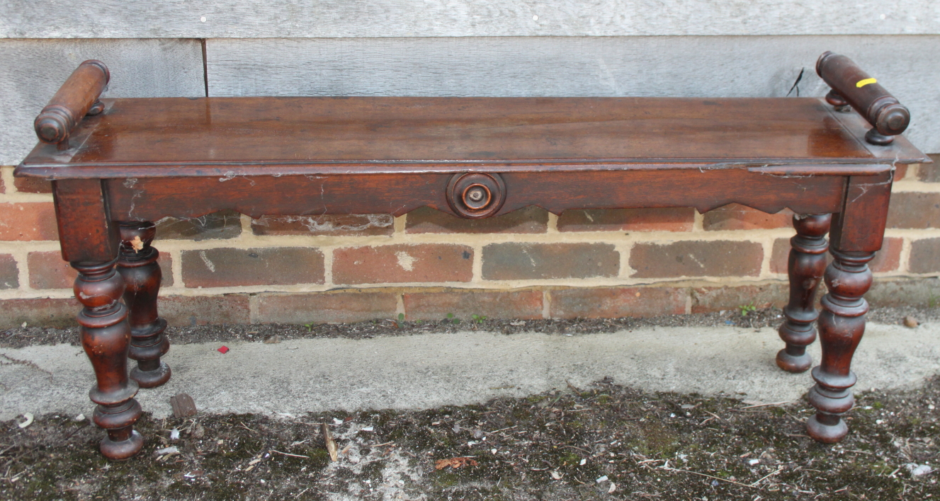 A Victorian mahogany window seat, on turned supports, 42" wide (cut down)