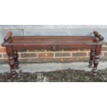 A Victorian mahogany window seat, on turned supports, 42" wide (cut down)