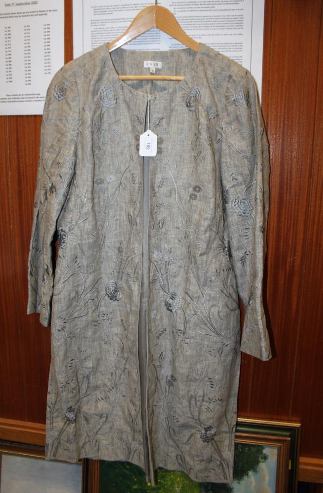 A lady's East grey floral brocade jacket with three-quarter sleeves